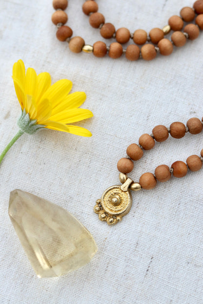 Sandalwood Mala Necklace with Brass Sun Charm Pendent